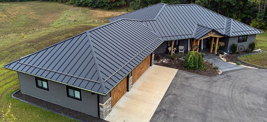 Single-story home with a dark standing seam metal roof